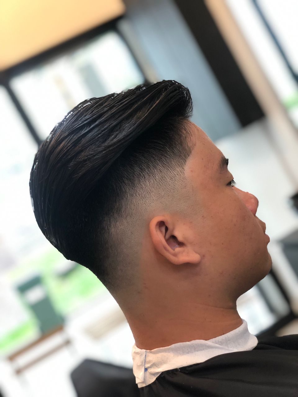 A finished slick back with a skin fade